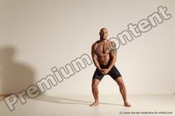 Underwear Gymnastic poses Man Black Muscular Bald Dancing Dynamic poses Academic